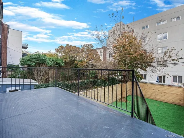 a view of a wrought iron fences in front of house