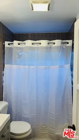 a view of bathroom with a sink and toilet