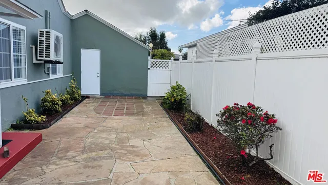 a vase of flowers sitting on a floor