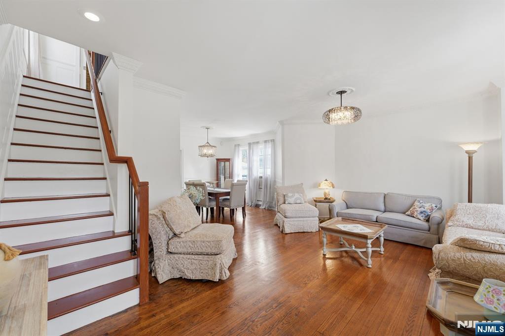 385 Berkeley Avenue Bloomfield, NJ 07003 - Photo 7 of 39 a living room with furniture and wooden floor