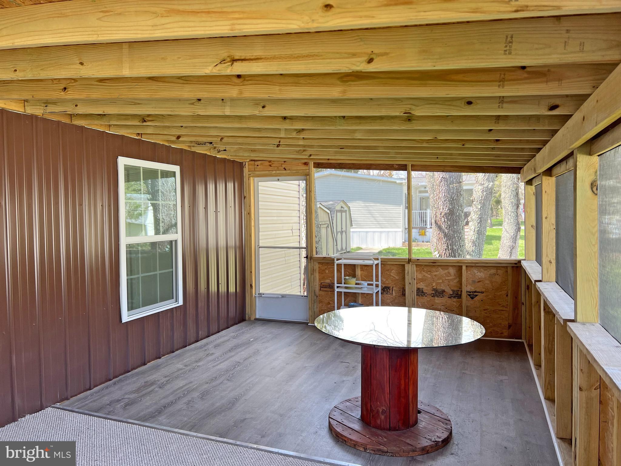 33943 Cedar Road, Unit 87 Lewes, DE 19958 - Photo 21 of 26 Right Screened Porch