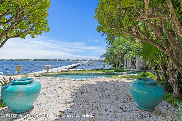 a front view of a house with a yard and a garage