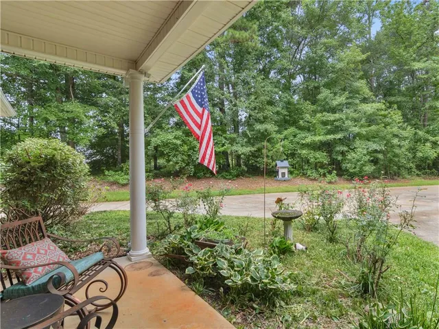 a view of a swimming pool with a yard