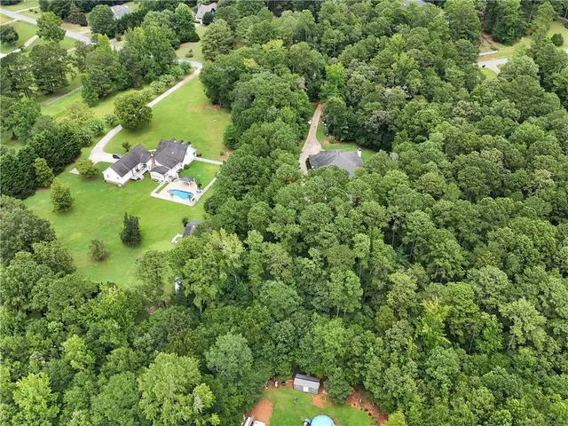 a backyard of a house with lots of green space
