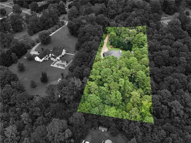 a view of a garden with a building