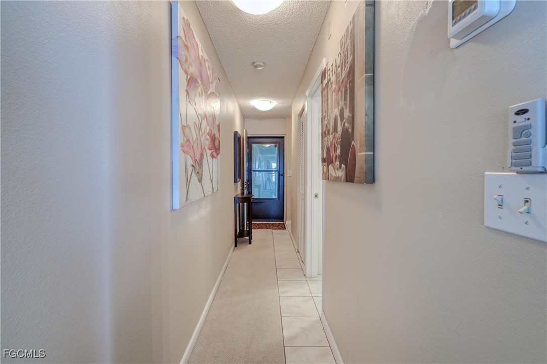 400 Lenell Road, Unit 408 Fort Myers Beach, FL 33931 - Photo 24 of 34 a view of a hallway with hallway