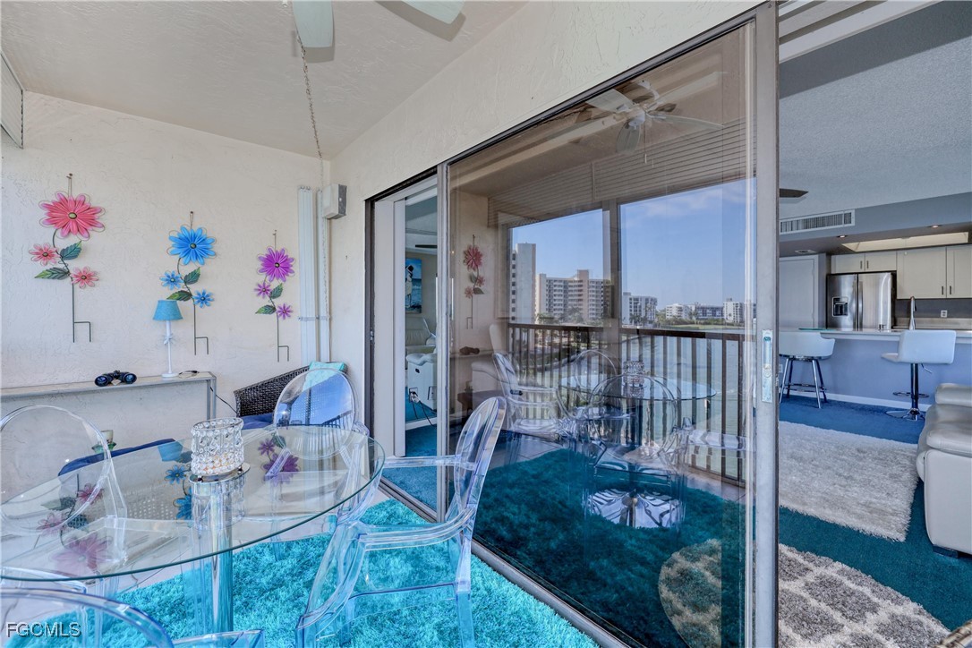400 Lenell Road, Unit 408 Fort Myers Beach, FL 33931 - Photo 30 of 34 a bath room with a glass door shower and fireplace