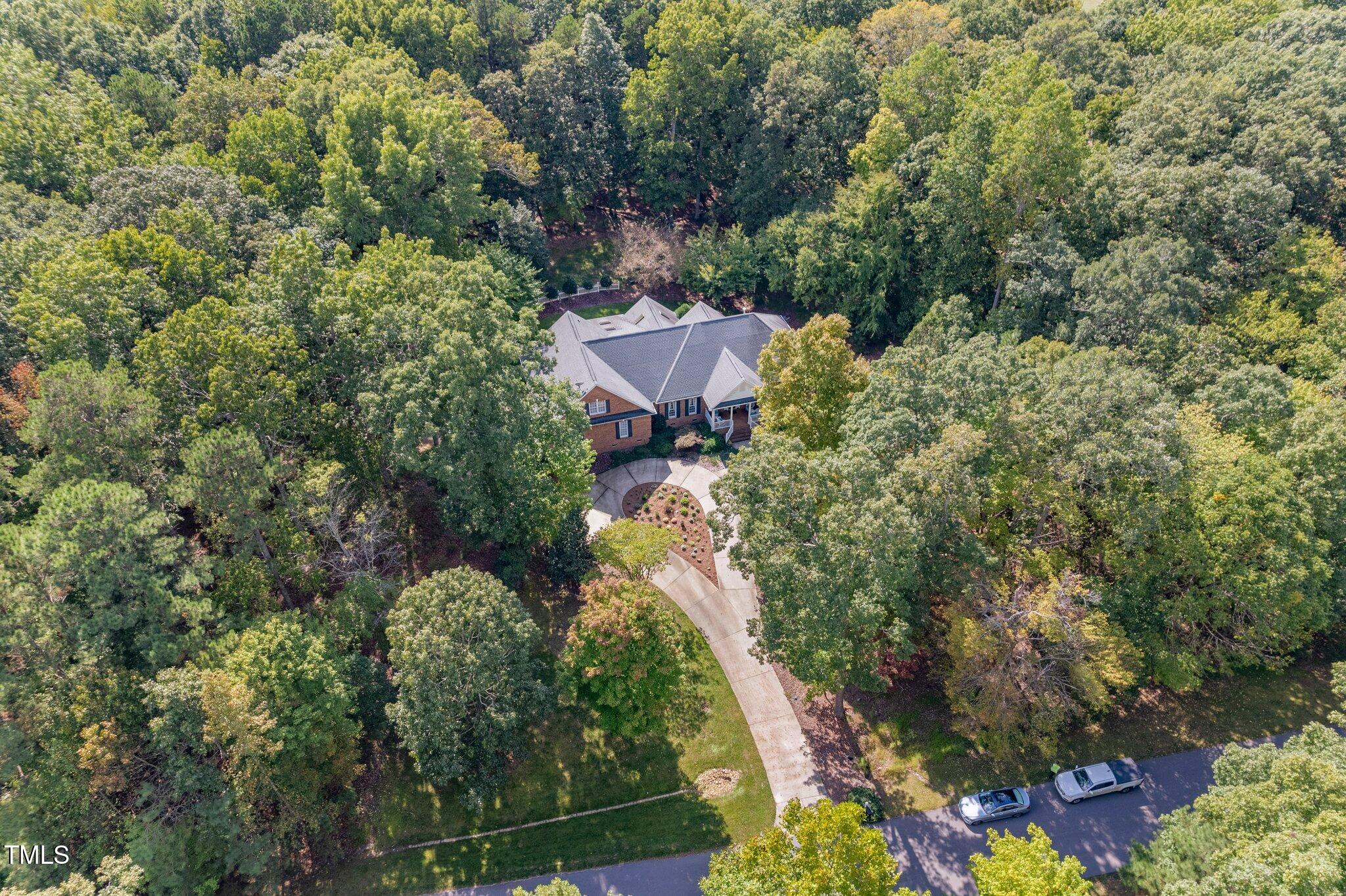 10937 Cahill Road Raleigh, NC 27614 - Photo 3 of 53 a view of a house with a yard and garden
