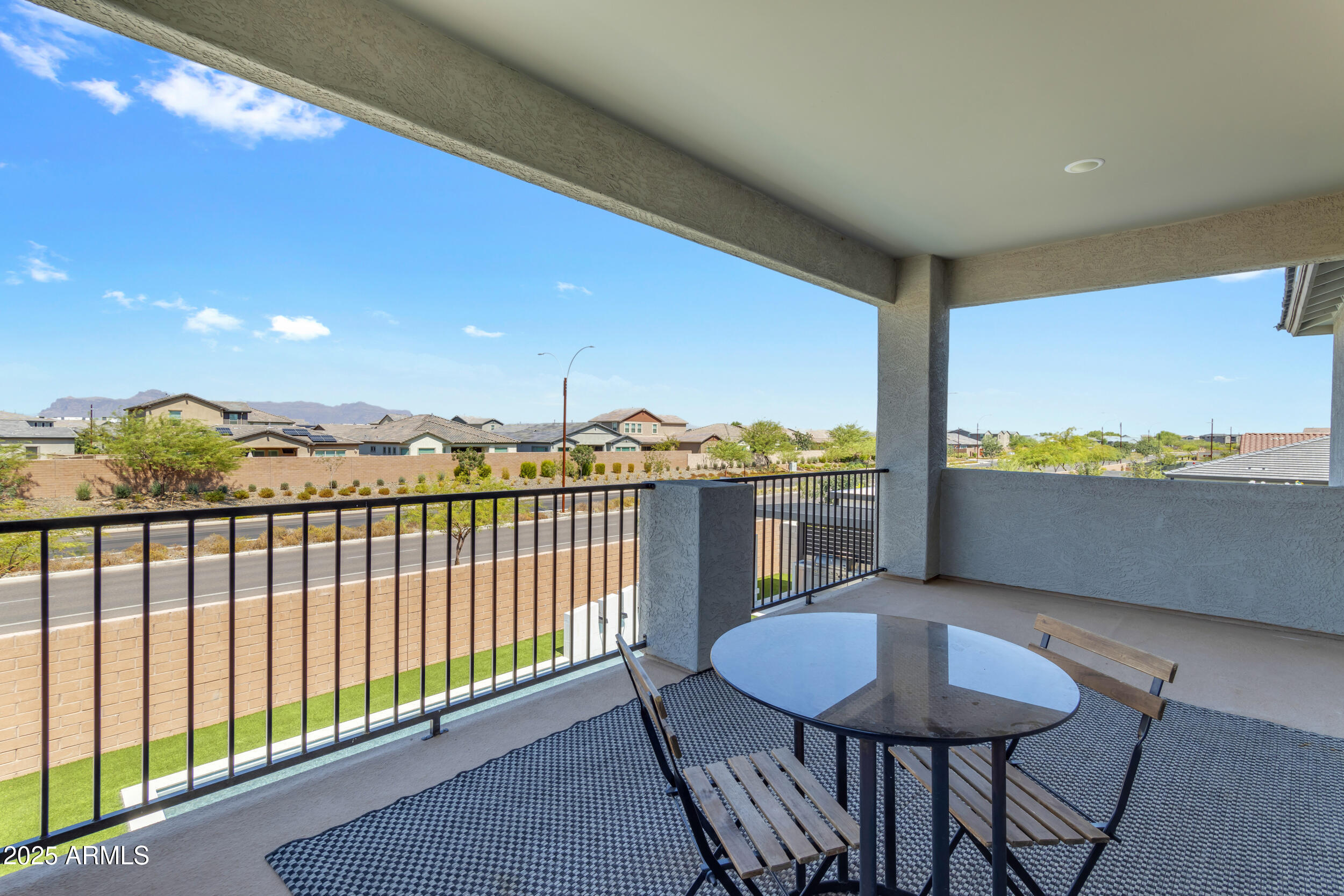 4247 South Element Mesa, AZ 85212 - Photo 57 of 120 a view of a balcony with table and chairs