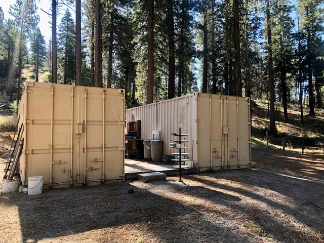 a view of a yard with chairs