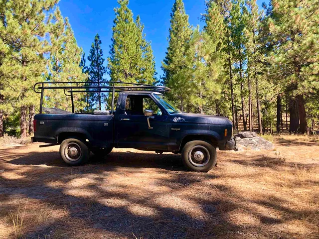 a view of swimming pool with a yard in the background