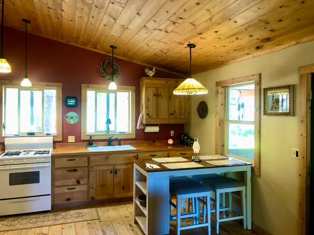 a living room with furniture mirror and a table