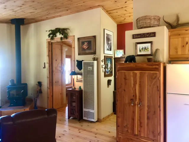 a living room with furniture a flat screen tv and a floor