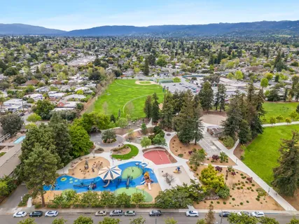 an aerial view of residential houses with outdoor space