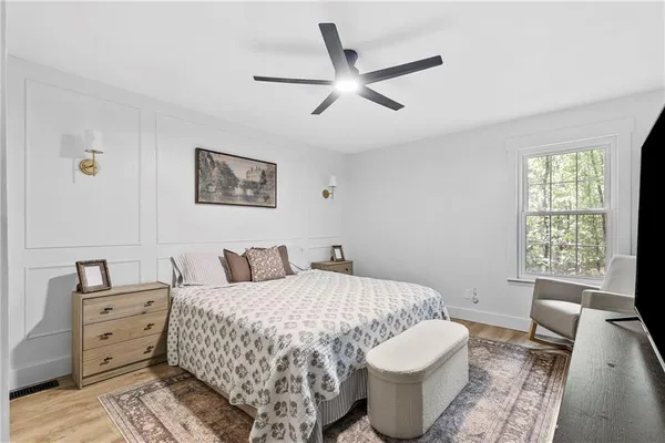 a bedroom with a bed and a couch