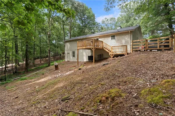 a view of a house with a backyard