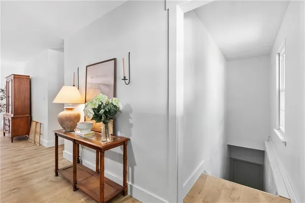 a workspace with furniture and a potted plant