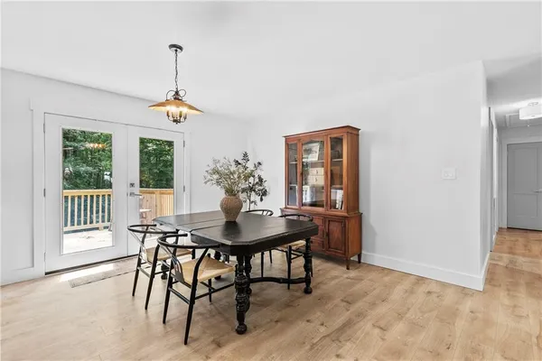 a view of a dining room with furniture and window