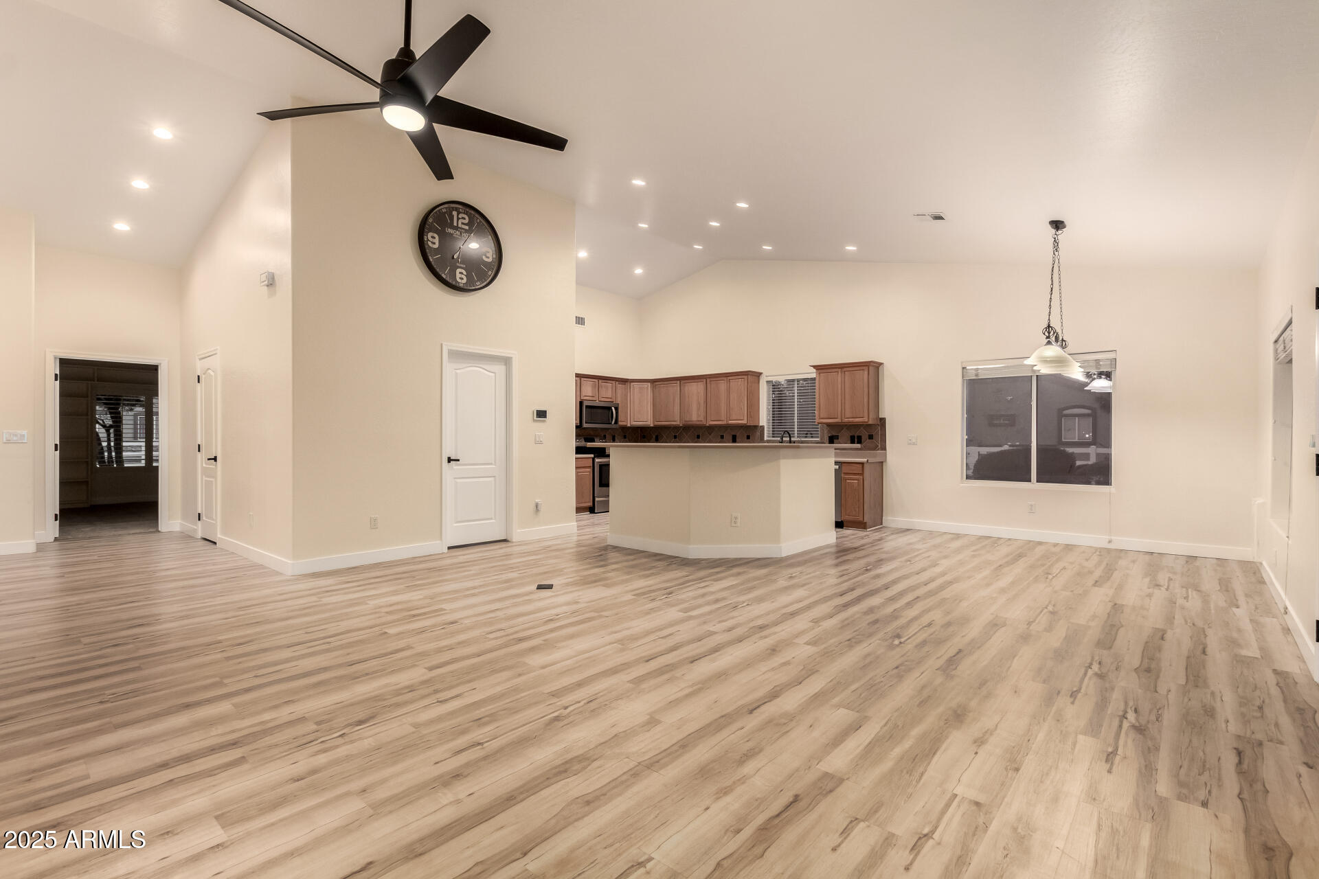 4273 South 165th Way Gilbert, AZ 85297 - Photo 12 of 56 a view of a kitchen with a dishwasher and wooden floor