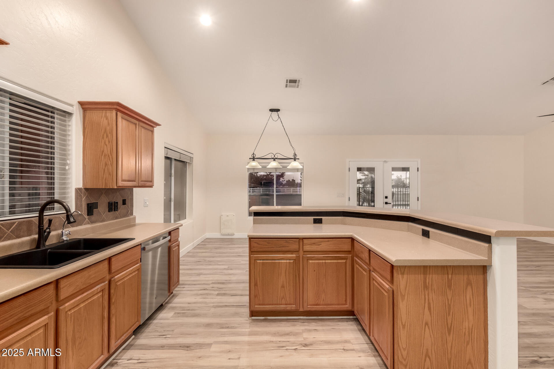 4273 South 165th Way Gilbert, AZ 85297 - Photo 18 of 56 a kitchen with a sink and cabinets