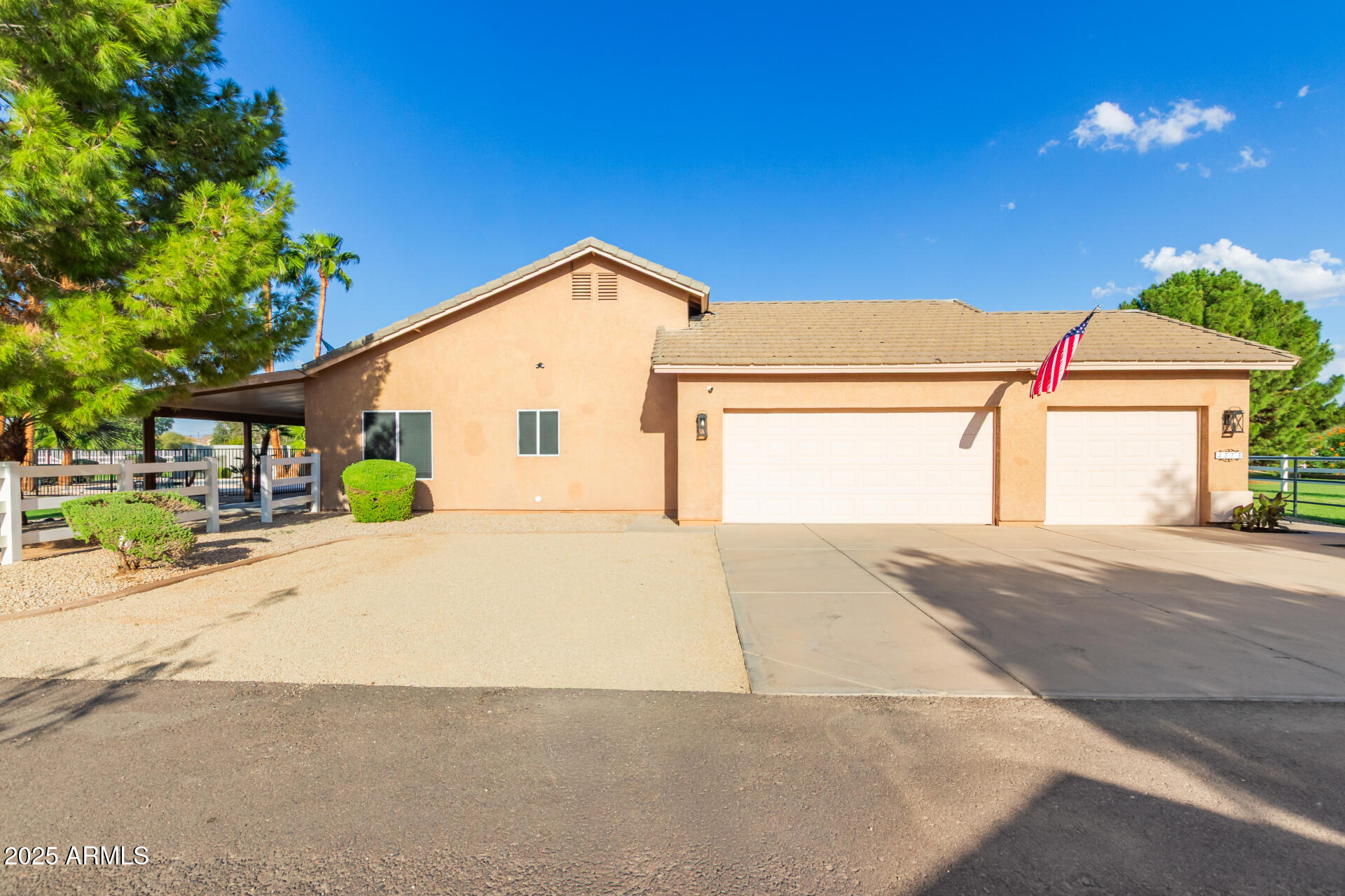 4273 South 165th Way Gilbert, AZ 85297 - Photo 3 of 56 a front view of a house with a yard and garage