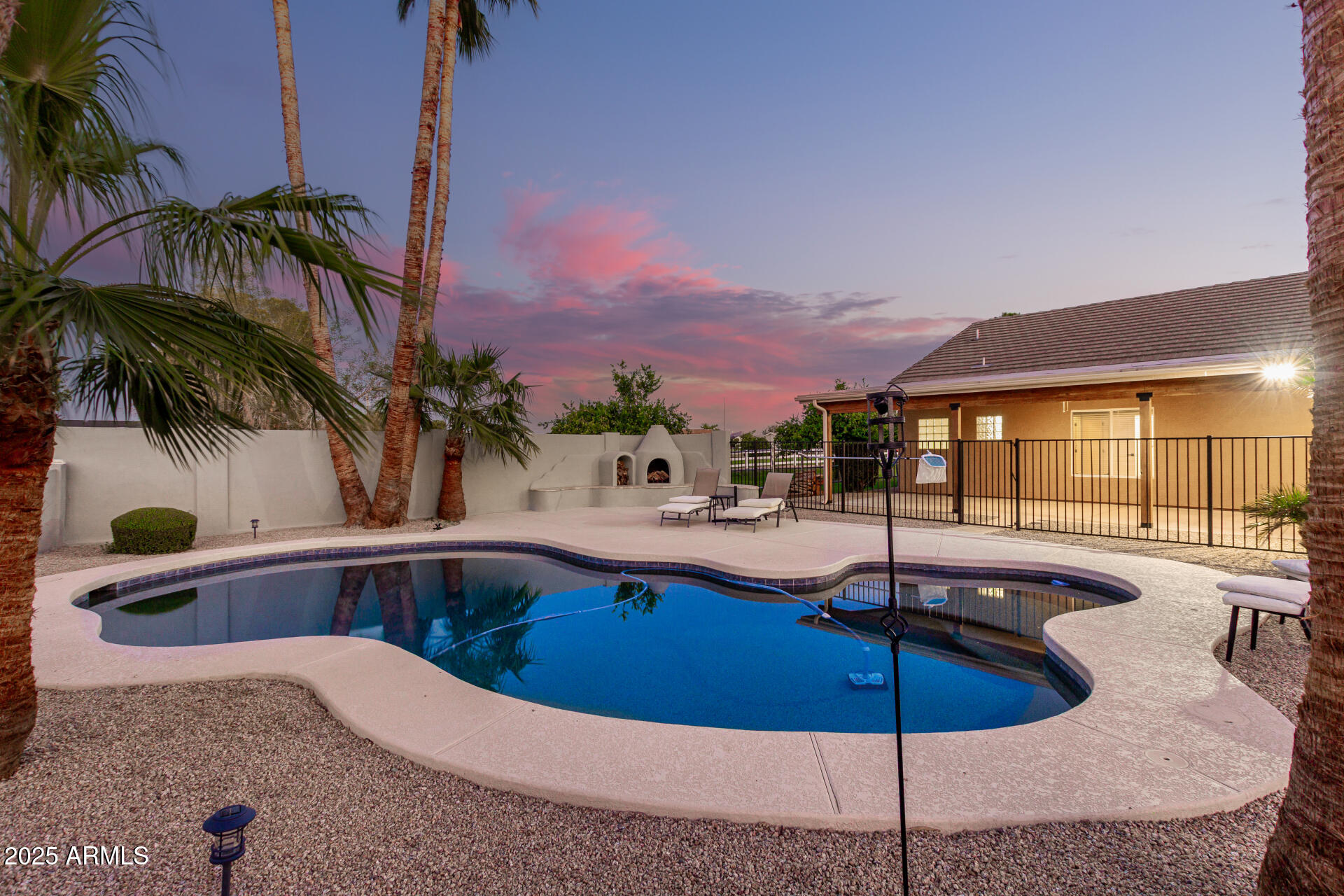 4273 South 165th Way Gilbert, AZ 85297 - Photo 43 of 56 a swimming pool with outdoor seating