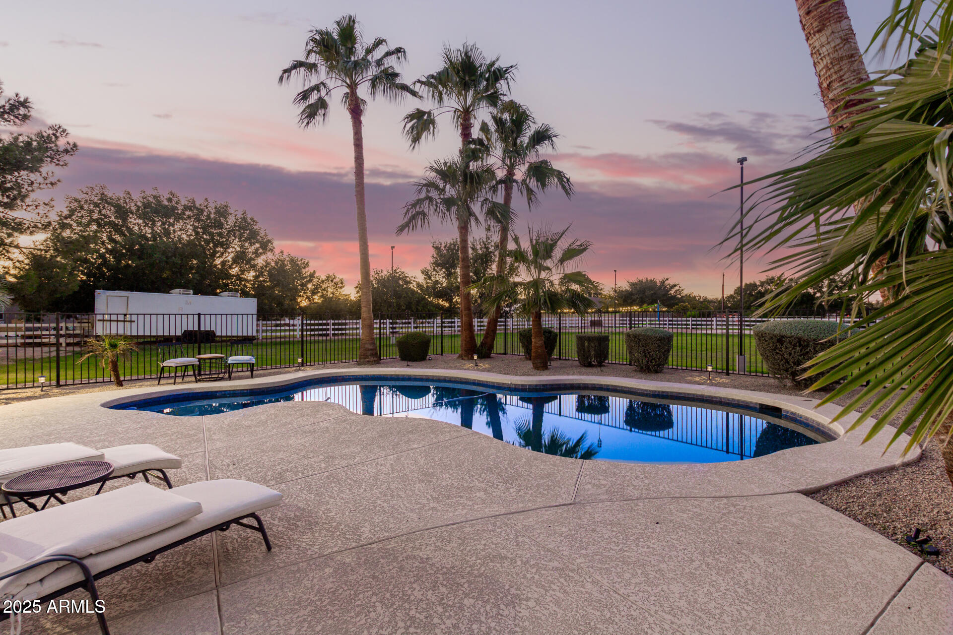 4273 South 165th Way Gilbert, AZ 85297 - Photo 45 of 56 a view of swimming pool with seating area and barbeque oven