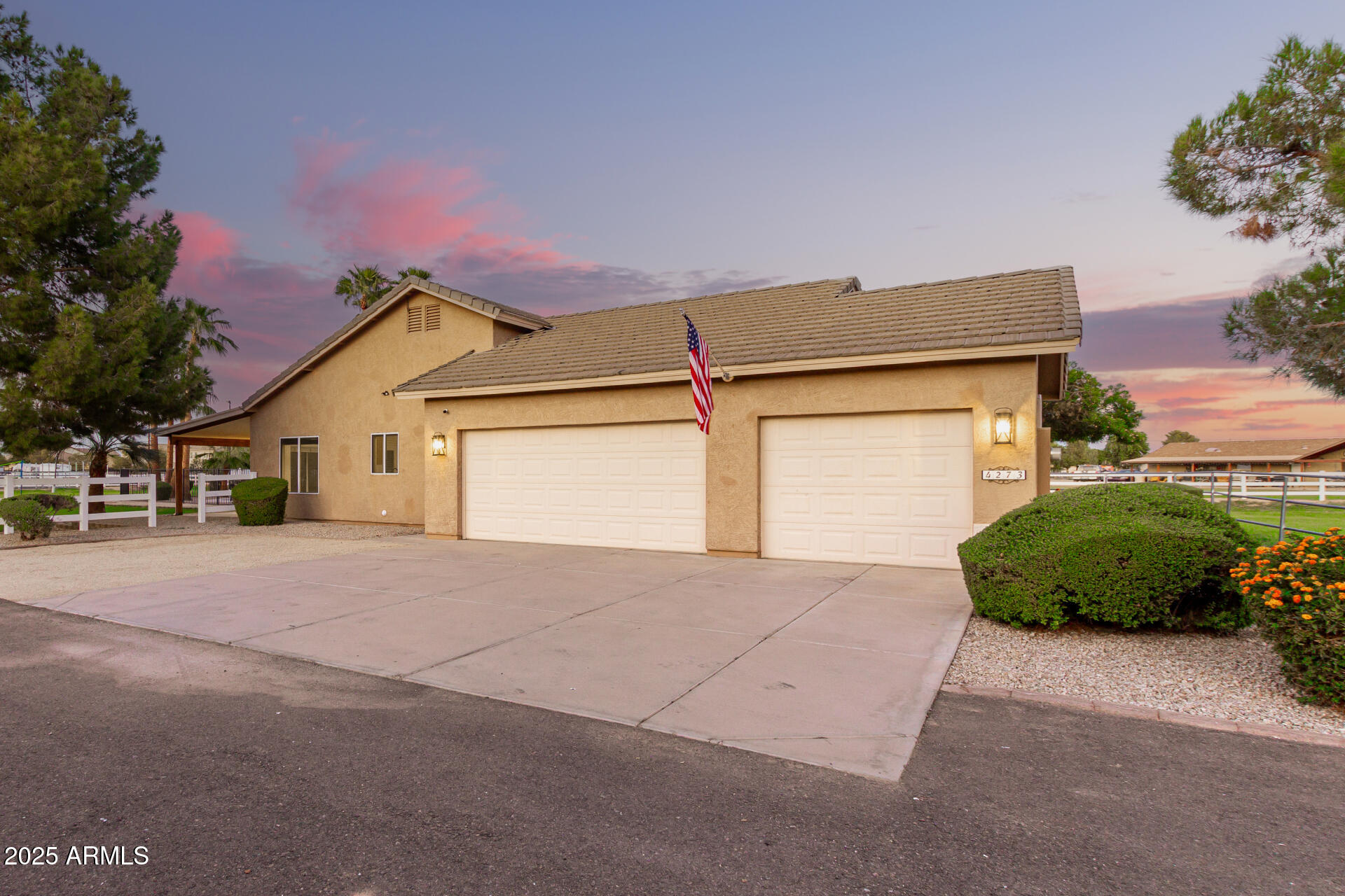4273 South 165th Way Gilbert, AZ 85297 - Photo 8 of 56 a view of a house with a yard and garage