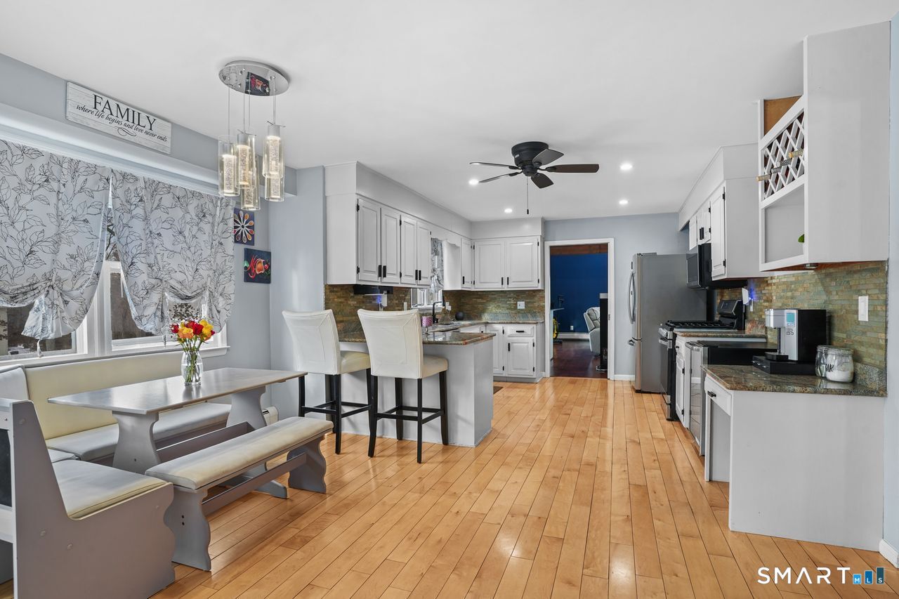 17 Moose Hill Road Trumbull, CT 06611 - Photo 11 of 40 a view of kitchen with cabinets and wooden floor
