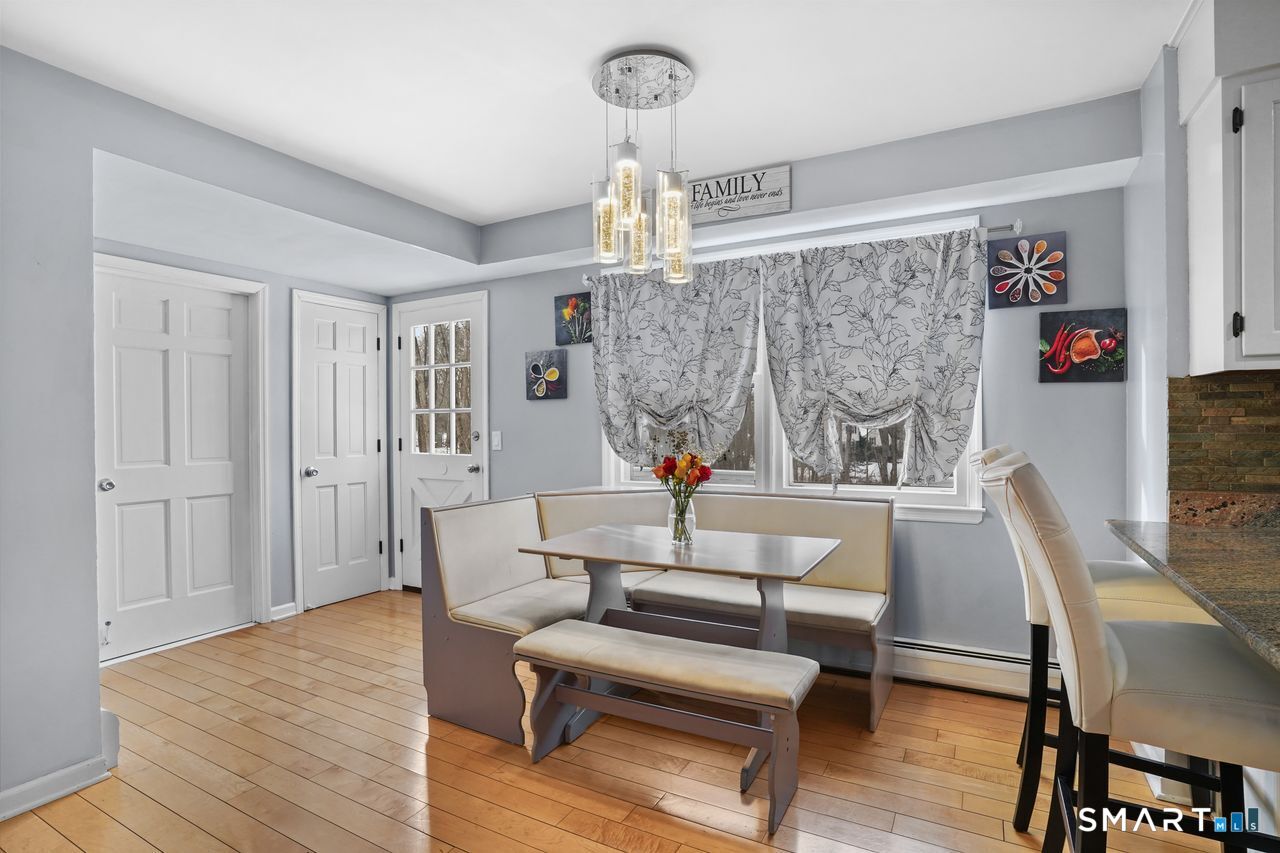 17 Moose Hill Road Trumbull, CT 06611 - Photo 14 of 40 a living room with furniture a dining table and a window