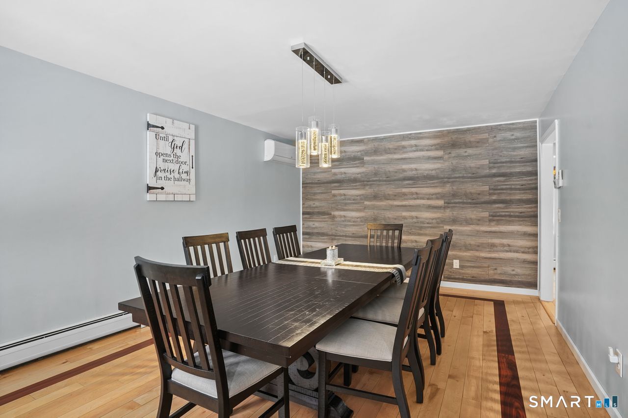 17 Moose Hill Road Trumbull, CT 06611 - Photo 15 of 40 a view of a dining room with furniture and wooden floor