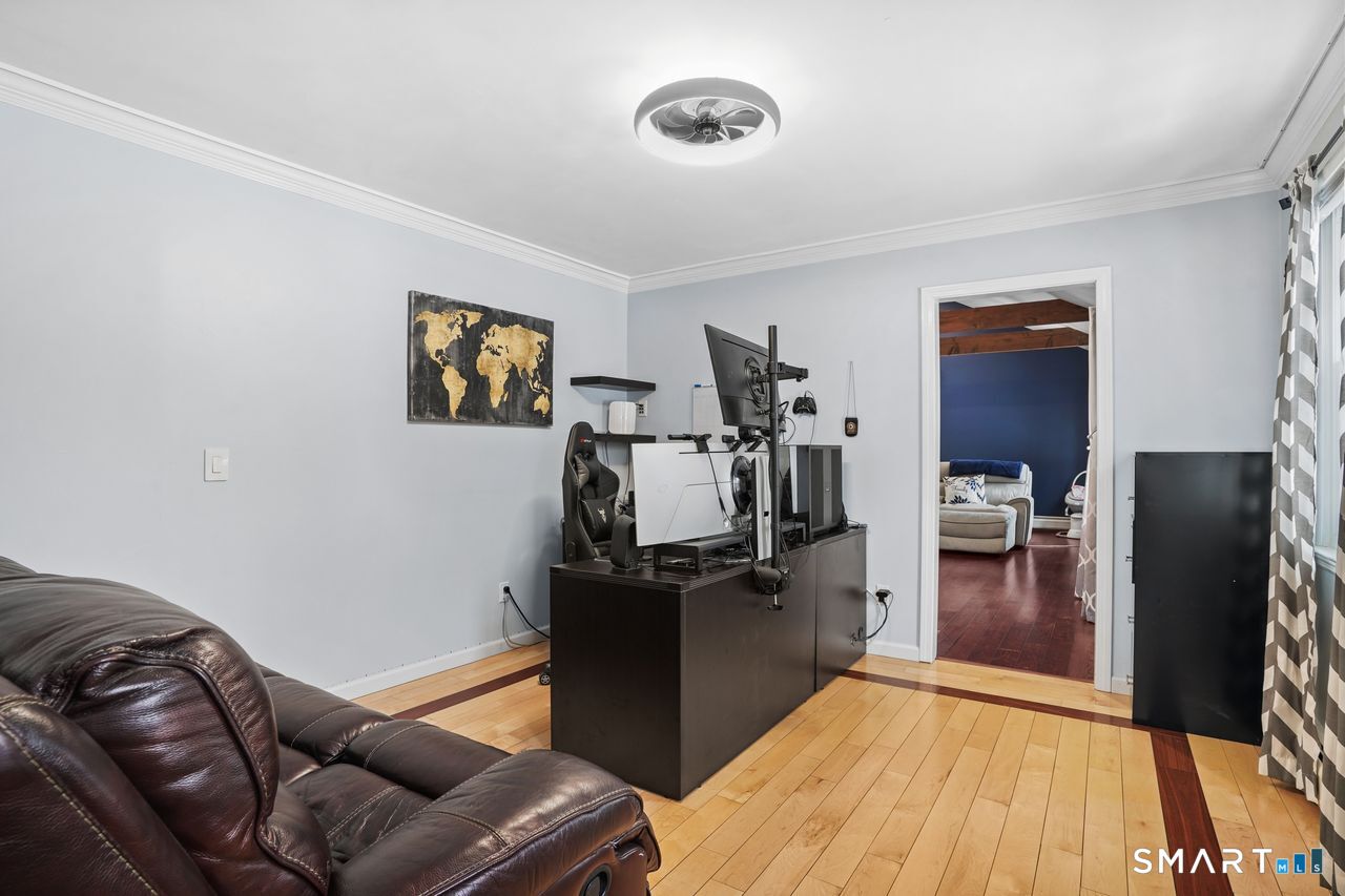 17 Moose Hill Road Trumbull, CT 06611 - Photo 17 of 40 a living room with furniture and a flat screen tv