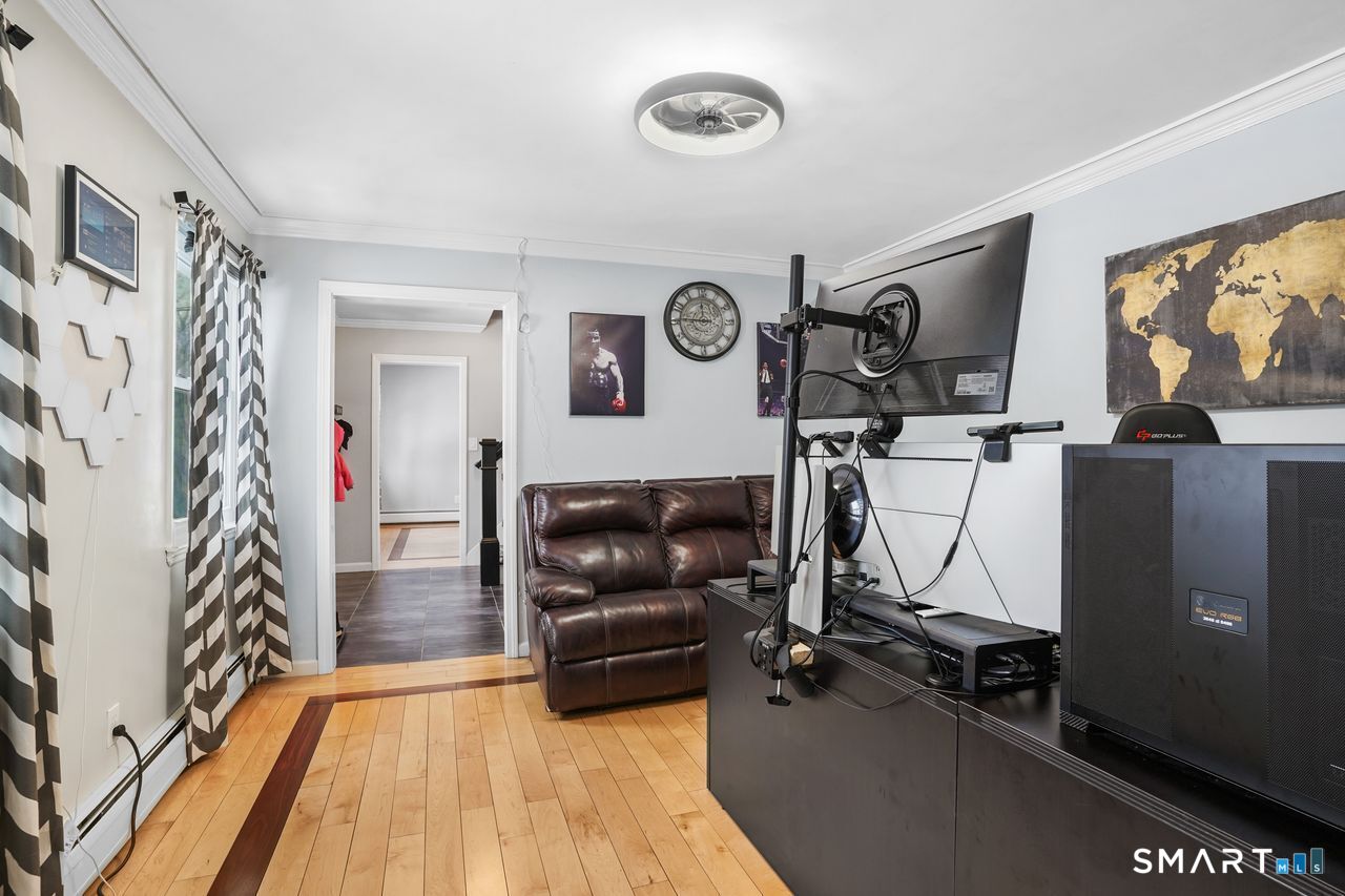 17 Moose Hill Road Trumbull, CT 06611 - Photo 18 of 40 a living room with furniture and a flat screen tv