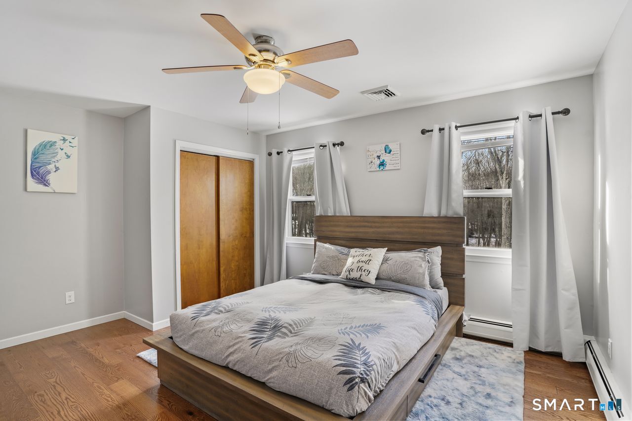 17 Moose Hill Road Trumbull, CT 06611 - Photo 26 of 40 a bedroom with a bed and a window