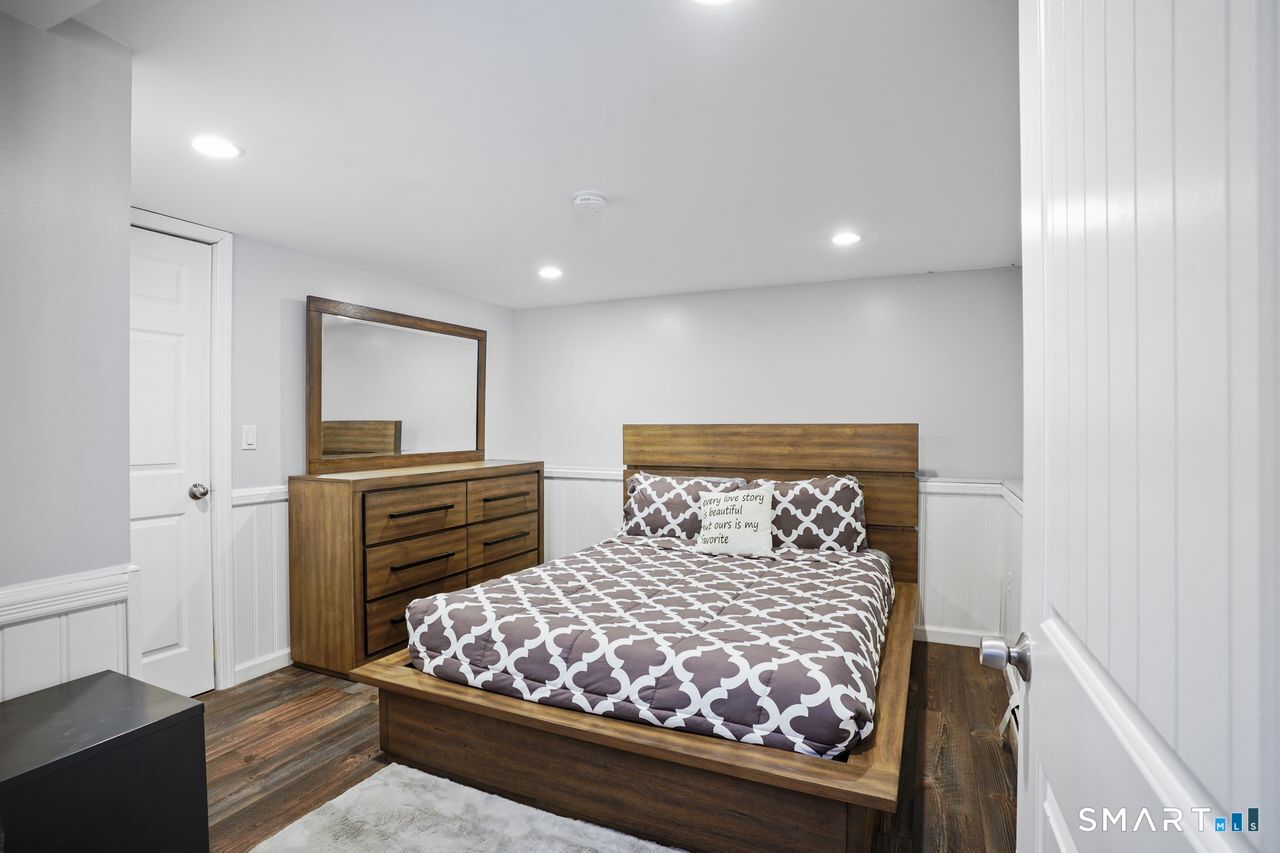 17 Moose Hill Road Trumbull, CT 06611 - Photo 32 of 40 a bedroom with a bed and wooden floor