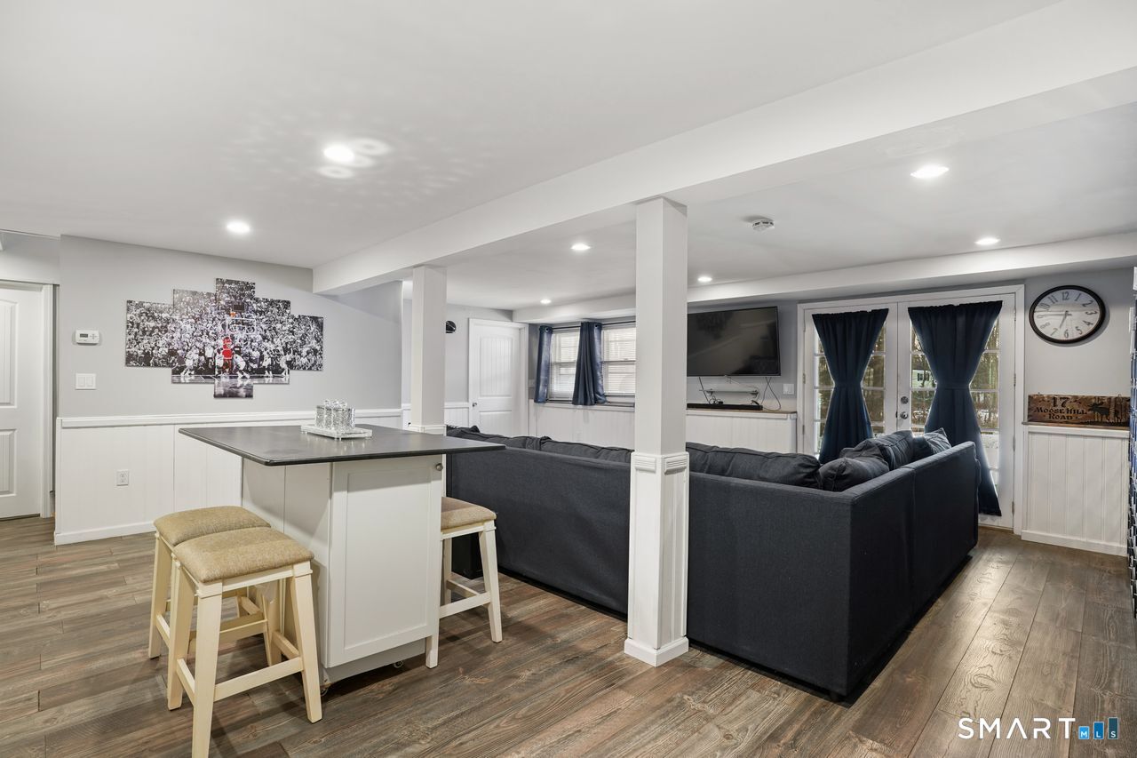 17 Moose Hill Road Trumbull, CT 06611 - Photo 35 of 40 a kitchen with cabinets and wooden floor