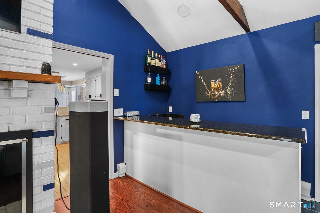 17 Moose Hill Road Trumbull, CT 06611 - Photo 8 of 40 a view of a living room with stainless steel appliances wooden floor