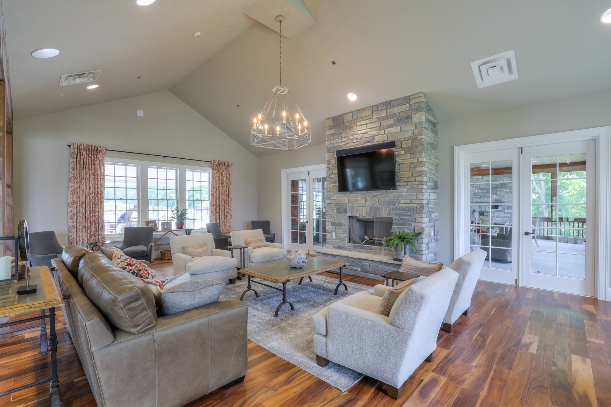 223 Cloverbrook Way Gallatin, TN 37066 - Photo 37 of 51 a living room with furniture a fireplace and a flat screen tv