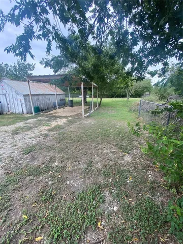 a view of a field with trees