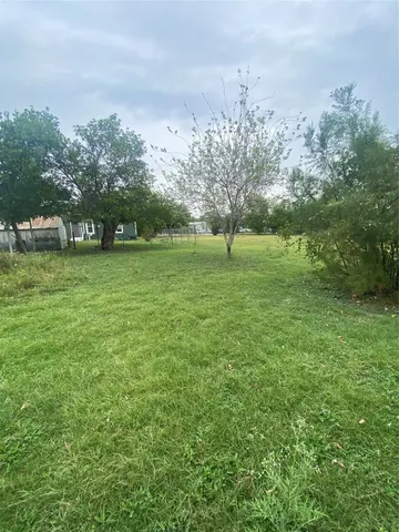 a view of outdoor space with deck and yard