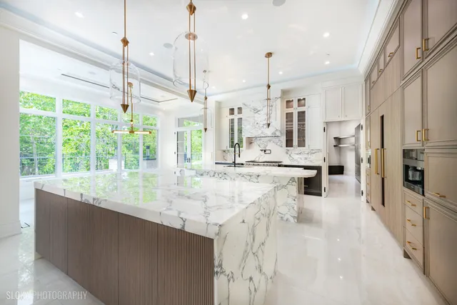 a stove top oven sitting inside of a kitchen