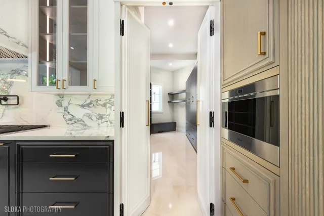 a view of a kitchen with a sink and a window