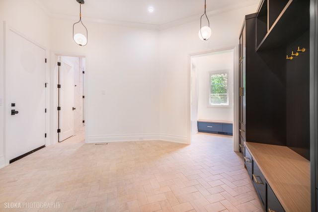 front view of a house with a garden