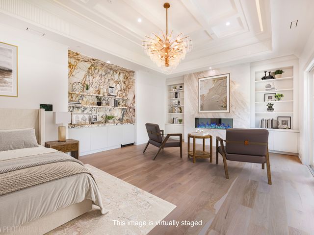 an aerial view of a house with a garden and trees