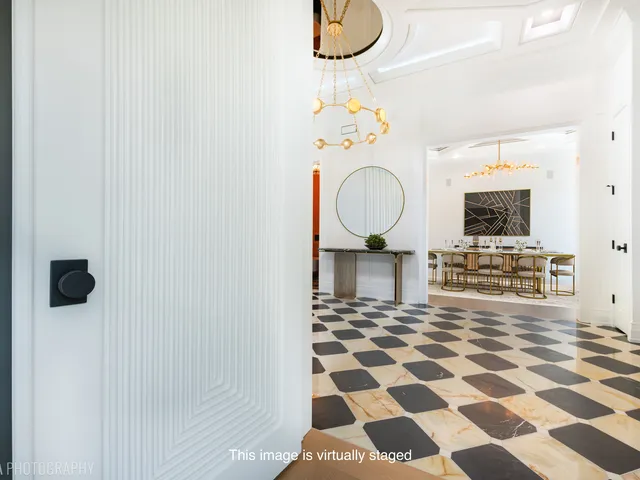 an empty room with windows and ceiling fan