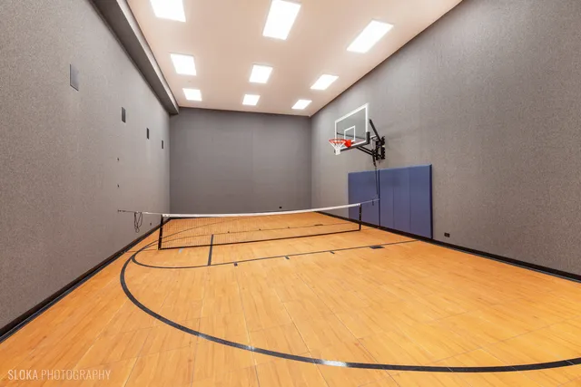 a view of a house with pool and chairs