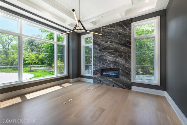 a large kitchen with kitchen island granite countertop a large window