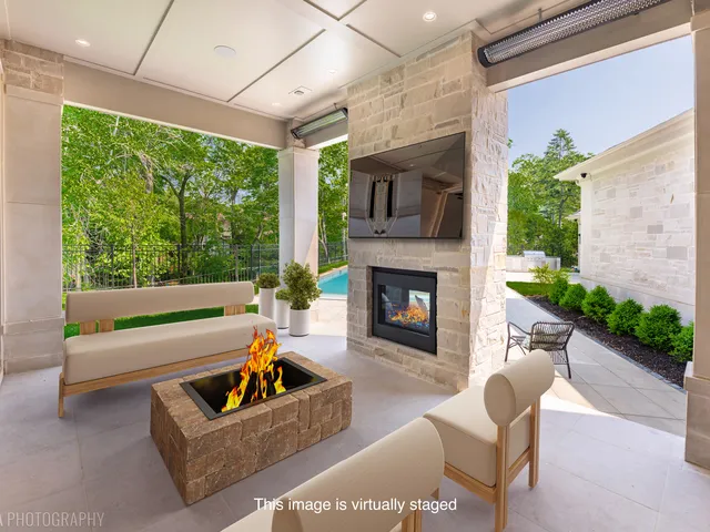 an aerial view of a house with a garden and trees