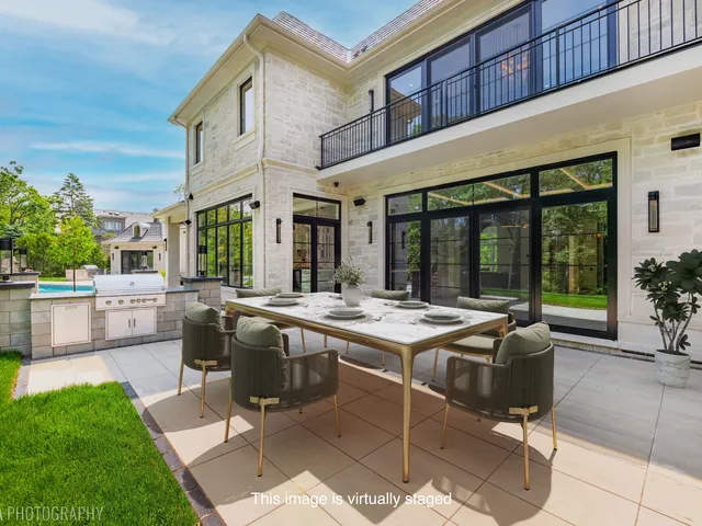 an aerial view of a house with a swimming pool
