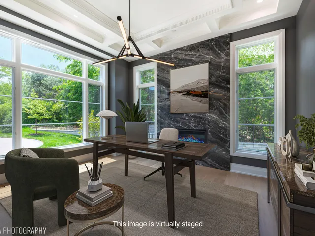 a large white kitchen with a large island oven a sink and white cabinets